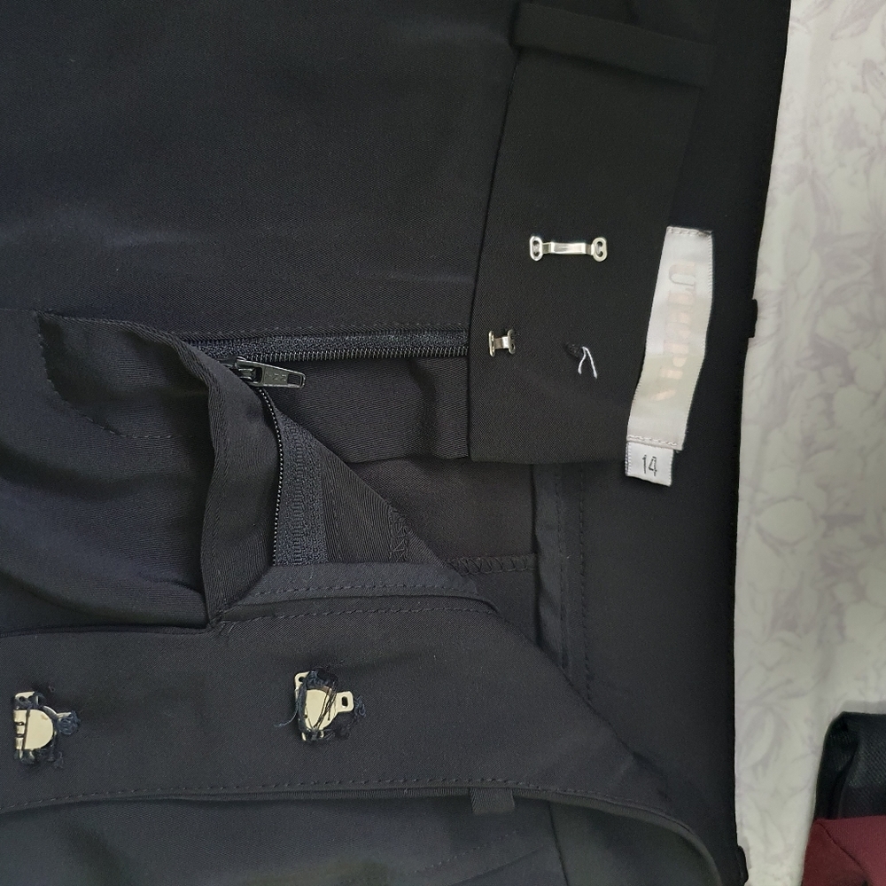 Full length black pants.